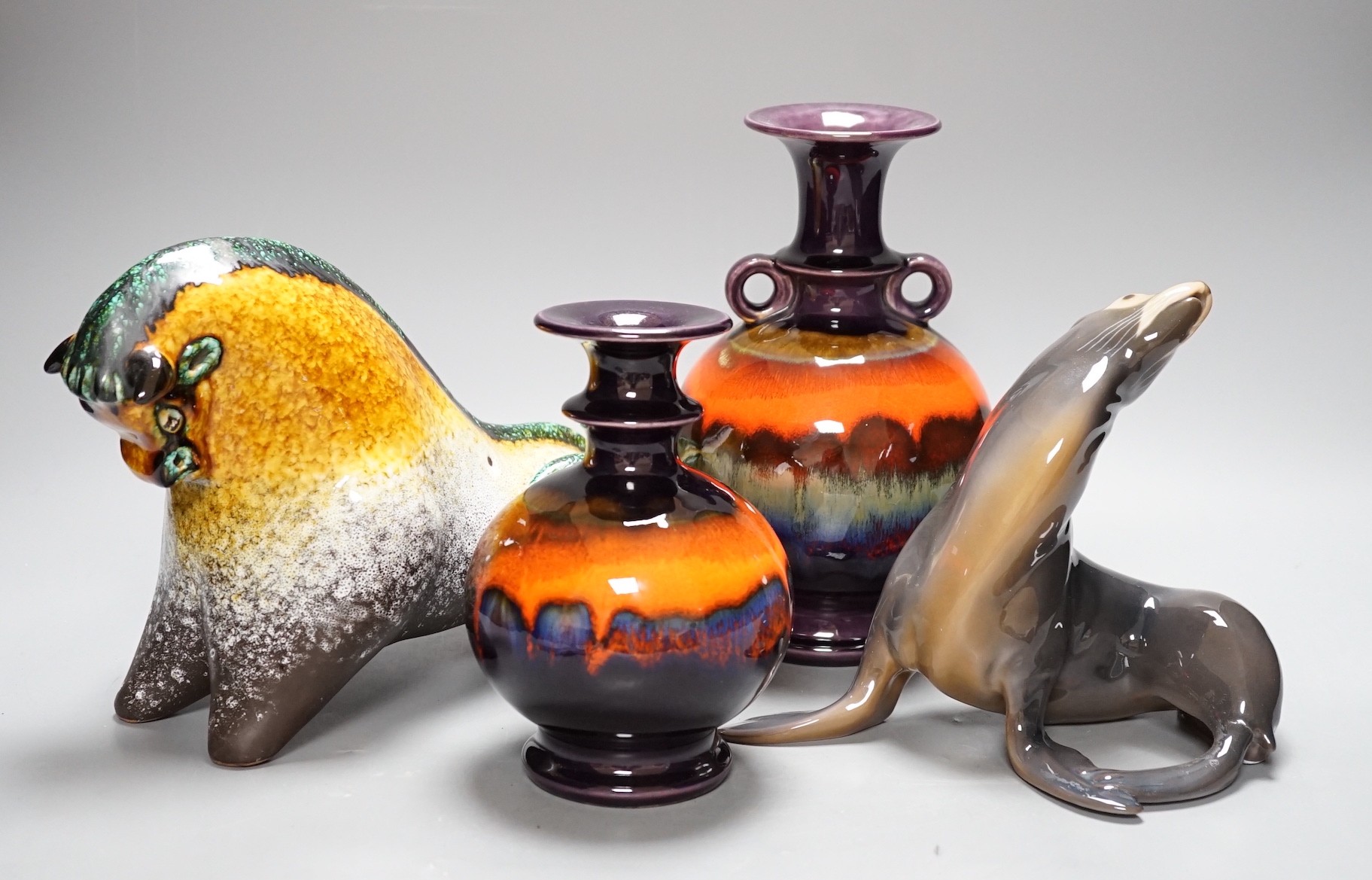 A Copenhagen porcelain seal, a Canadian pottery bull and two German vases tallest 21.5cm